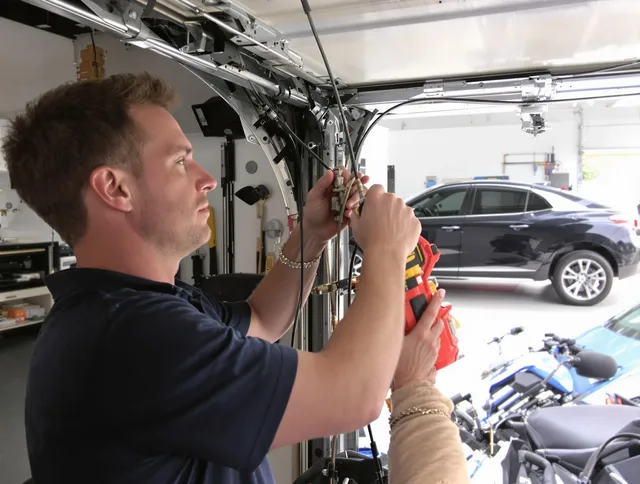 Aurora Garage Door Repair safety certified technician performing cable replacement in Aurora