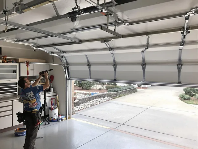 Garage door track repair service by Aurora Garage Door Repair in Aurora